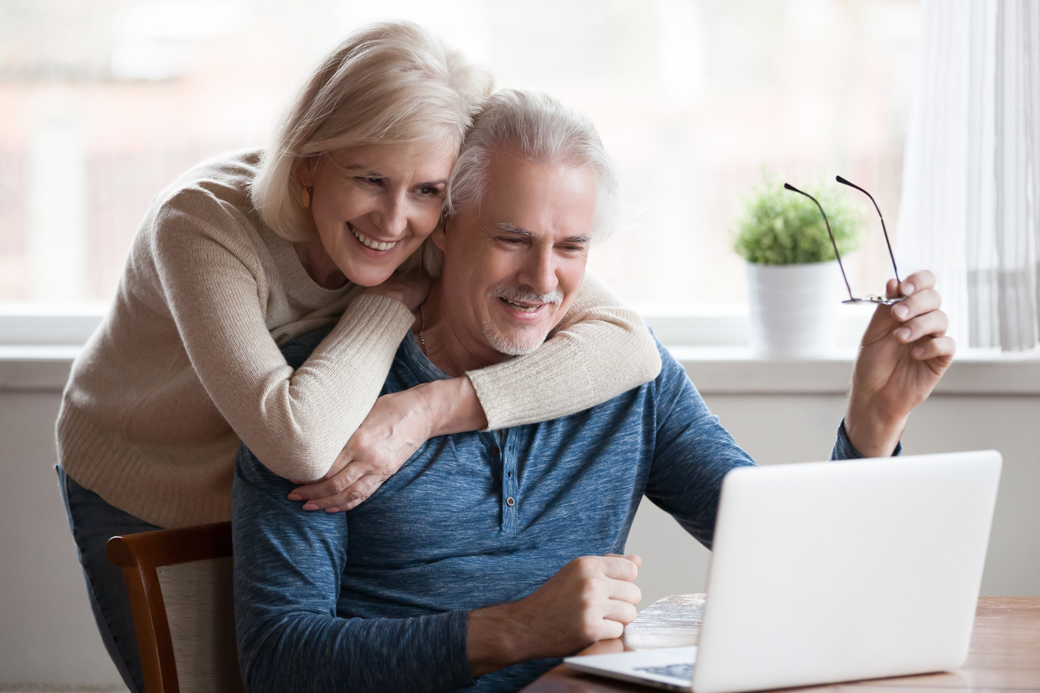 Seniors on laptop Seniors on laptop looking at Medicare plans