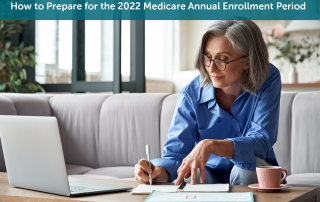 A white senior woman sitting on a grey couch in front of her laptop preparing for the Medicare Annual Enrollment Period