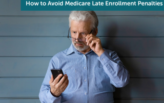 Senior man in a blue shirt looking at his cellphone, tilting his reading glasses in surprises as he looks at his Medicare late enrollment penalties.