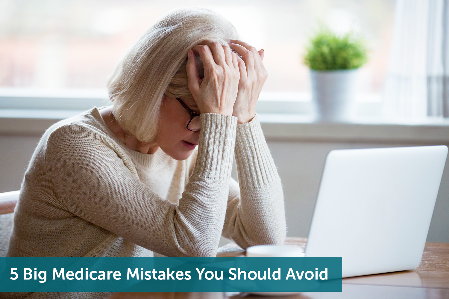 Senior white woman with grey should length hair holding her head in her hands as she realizes she made a few Medicare mistakes.