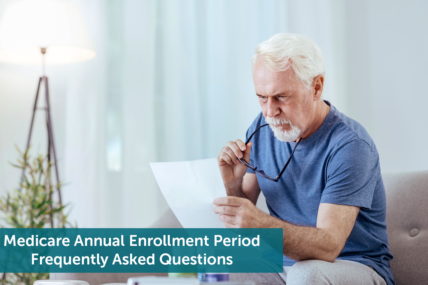 Senior man sitting on couch, thinking about how he will change his Medicare plan during the Medicare Annual Enrollment Period.