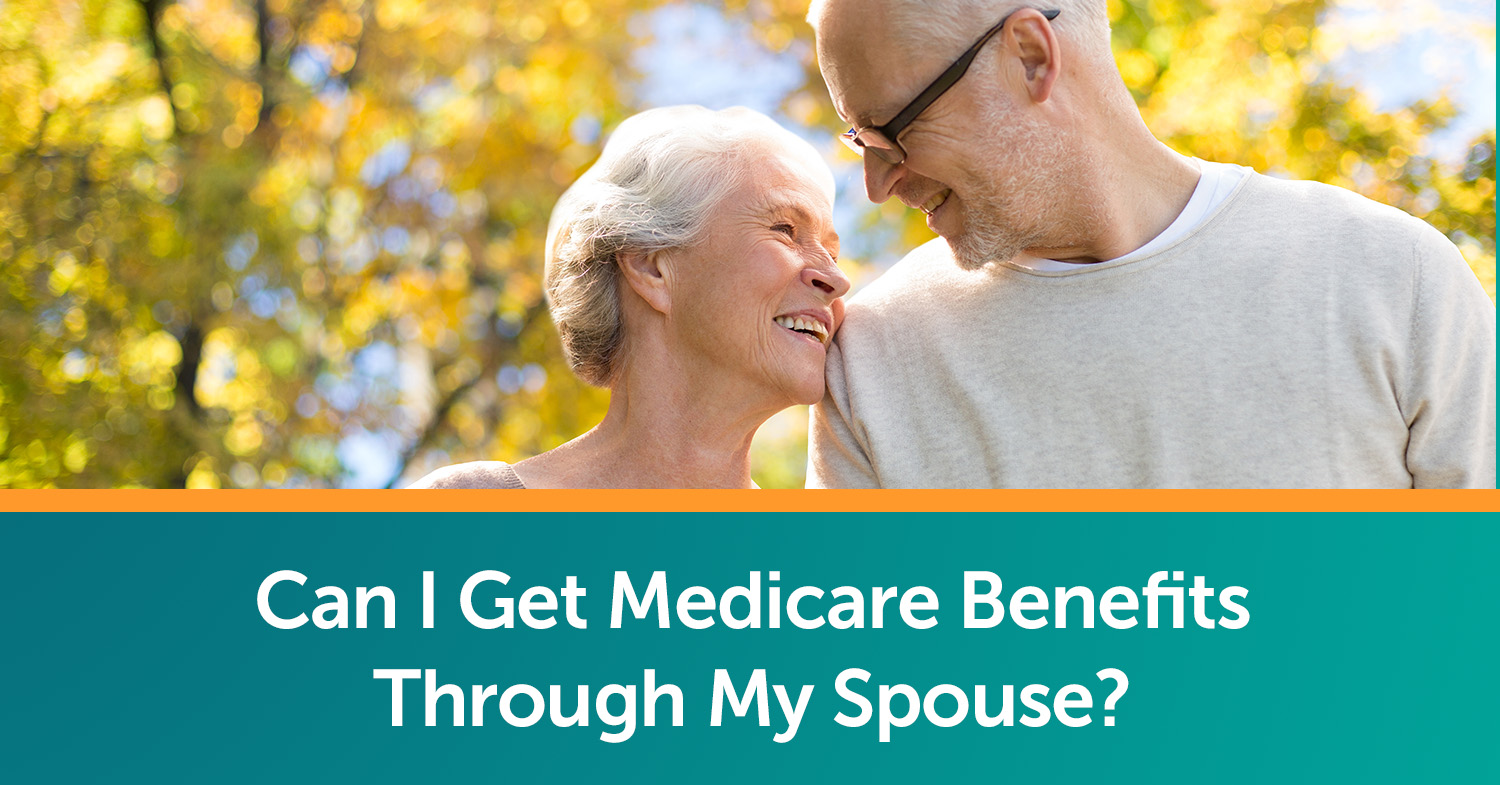 A senior couple walking outside, discussing their Medicare benefits.